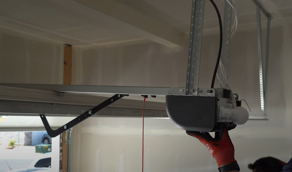 a technician repairing a garage door opener, representing expert services available in Myakka City, Florida. Keywords: garage door opener repair.