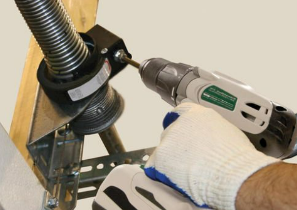 Professional technician performing garage door spring repair in Myakka City, enhancing safety and functionality for homeowners.